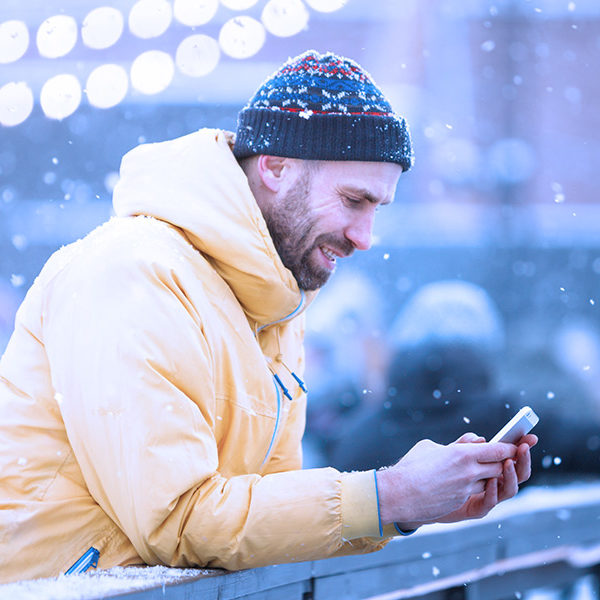 Guy in the Snow with a Yellow Coat