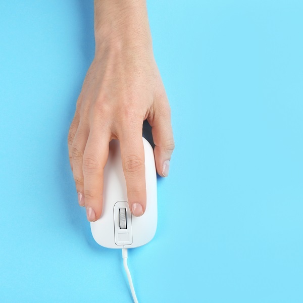 person using a mouse for a computer